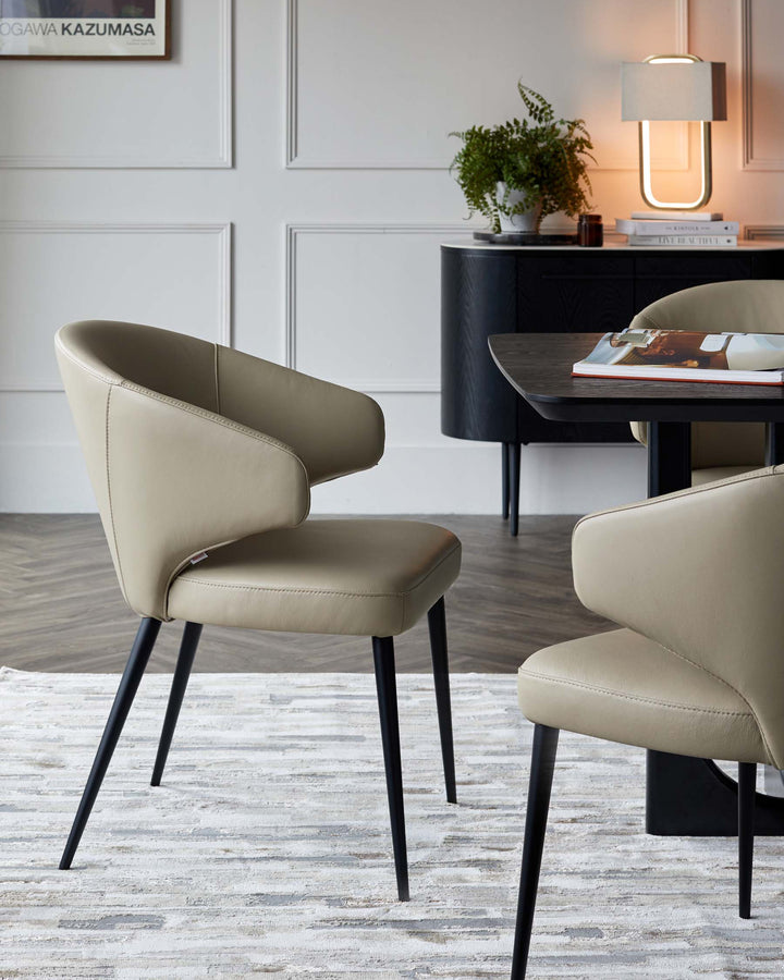 Stylish beige leather chairs with minimalist design, paired with a sleek black dining table and contemporary decor elements.