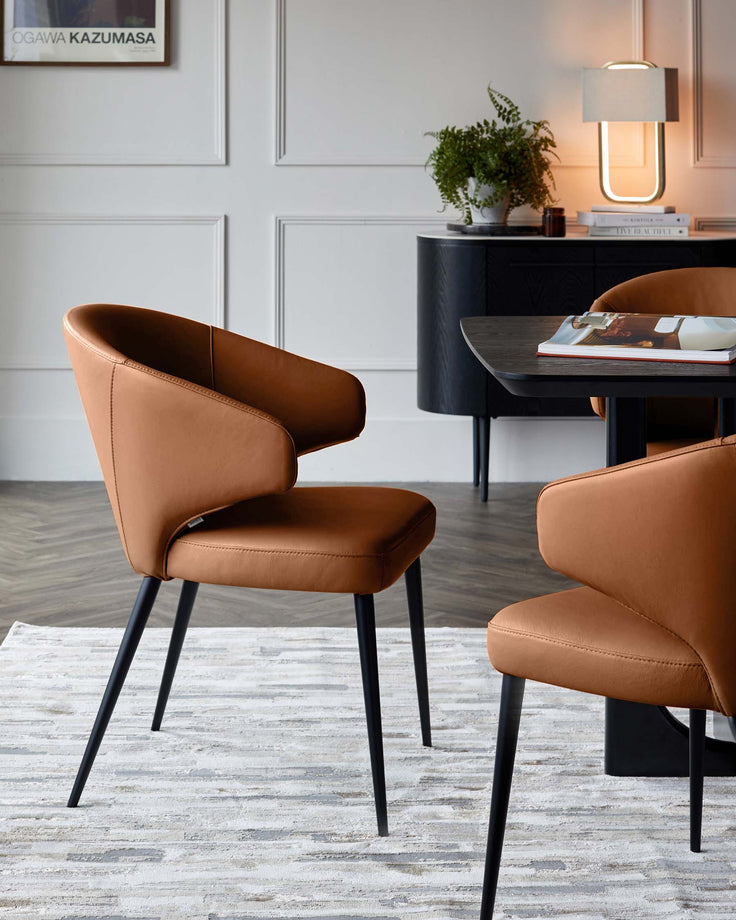 Tan leather dining chair with curved backrest and black metal legs, shown in a modern dining room setting.