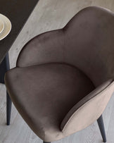 Lani dining chair in mocha velvet, shown from above at an angle, displaying curved backrest and seat cushioning with dark legs.
