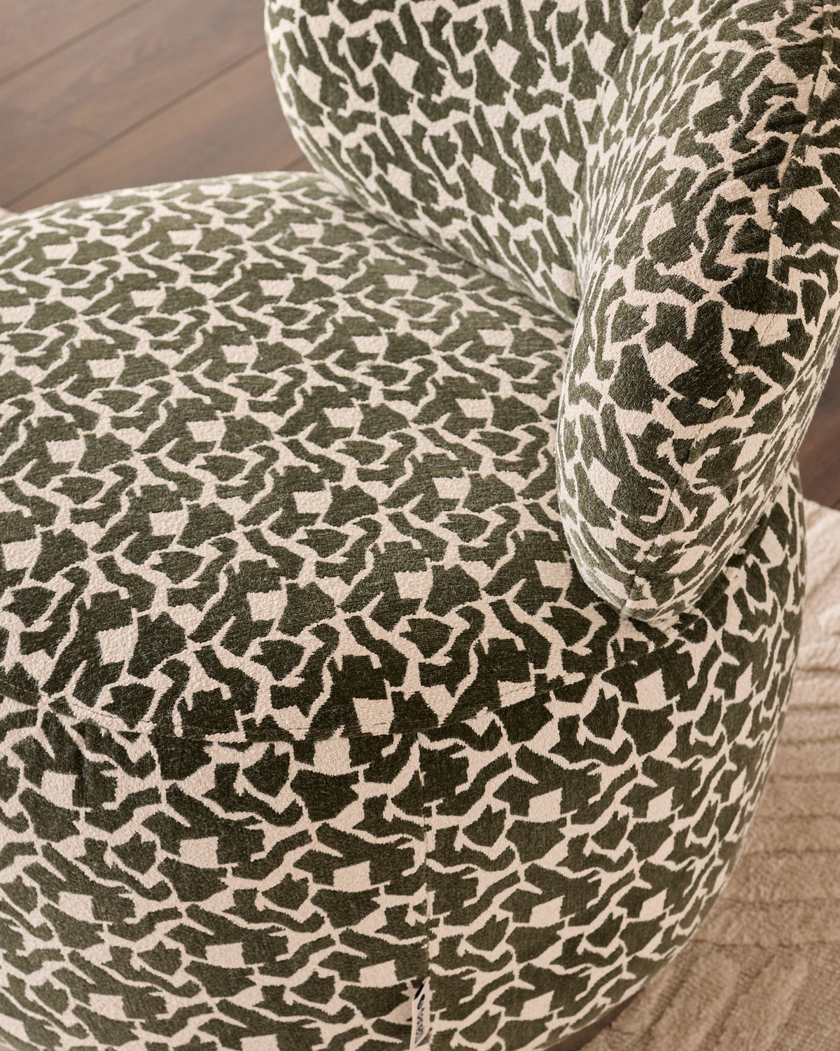 Leda dark green abstract fabric swivel accent chair