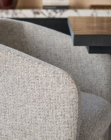 Leighton dining chair in grey chenille fabric with black metal frame, close-up detail view.