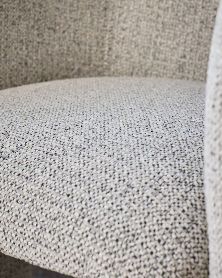 Close-up of grey chenille fabric on Leighton dining chair seat and backrest, showing textured weave detail.