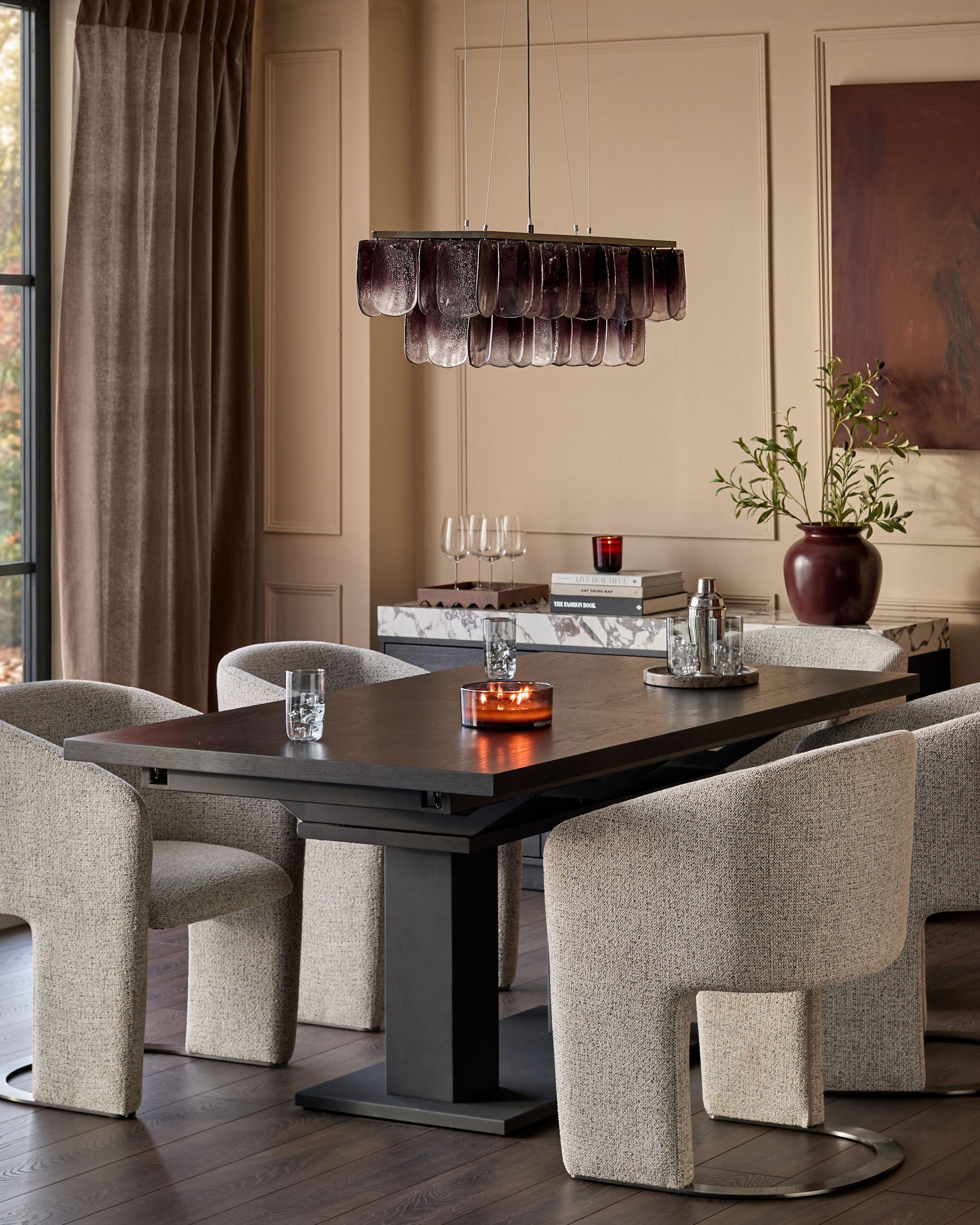 Leighton dining chair in grey chenille fabric with black chrome frame, shown in modern dining room setting.