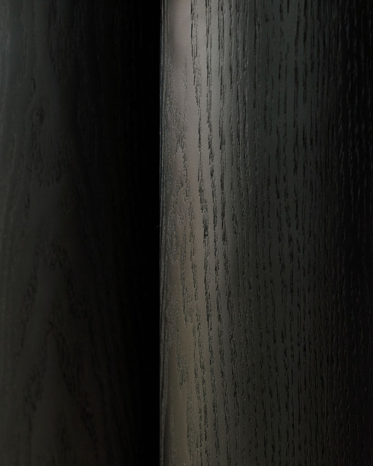 Dark wood console table with natural wood grain texture and finish, angled side view.