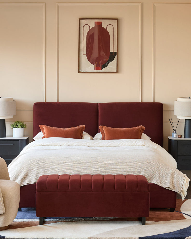 Leona super king ottoman bed in toffee red velvet, shown in a styled bedroom setting with coordinating pillows and bench.
