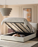 Upholstered ottoman bed with lifted mattress revealing storage space underneath.
