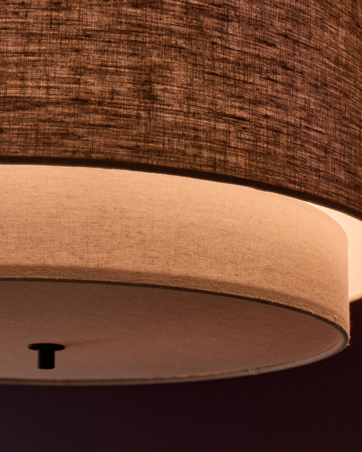 Leonie pendant light with natural linen shade and mocha base, close-up detail view showing cylindrical fabric shade and fixture.