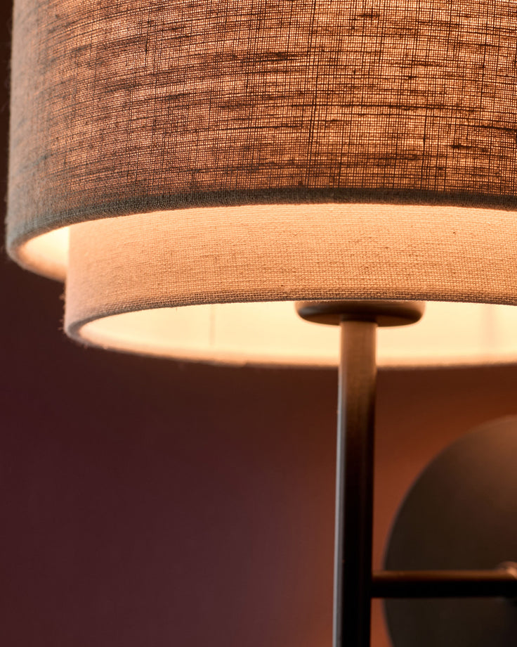 Leonie wall light with layered linen shade in natural and mocha tones, close-up detail view.