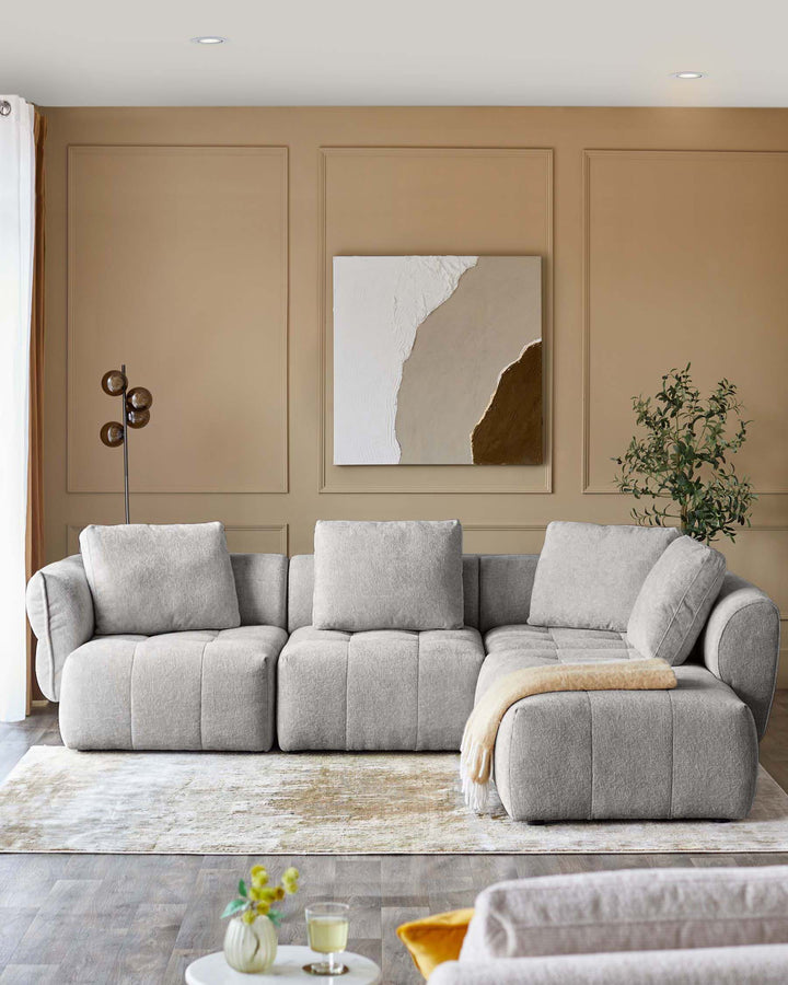 Lillian right corner chaise sofa in light grey weave, displayed in a contemporary living room with neutral beige walls and modern decor.