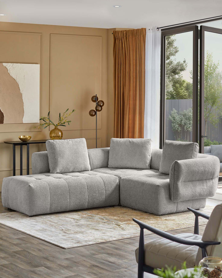 Lillian left small corner sofa in light grey weave, shown in a modern living room setting with cushions.