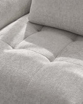 Close-up of light grey weave fabric on Lillian single module sofa, showing cushion texture and seaming detail.