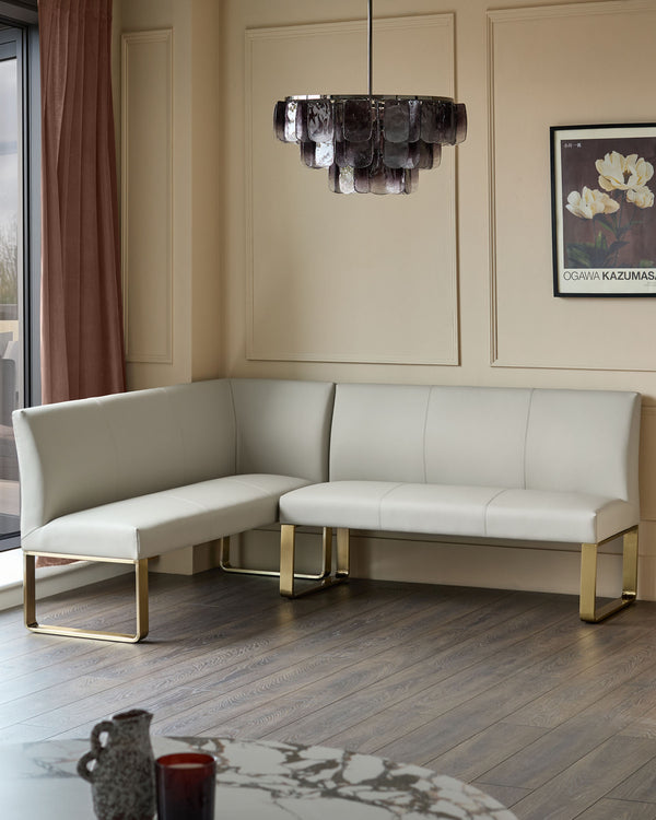 Loop 5-seater right-hand corner dining bench in light grey faux leather with brushed brass legs, shown in a modern living room setting.