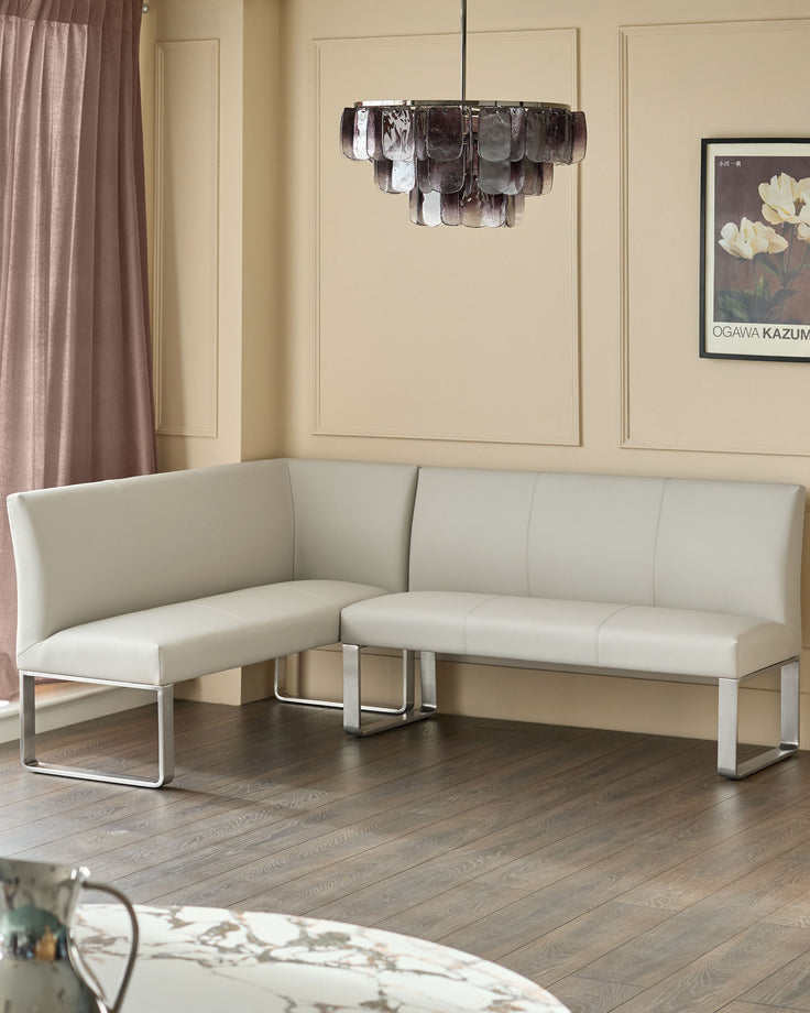 Light grey faux-leather corner bench with stainless steel frame, right-hand configuration, 5-seater in modern living room.