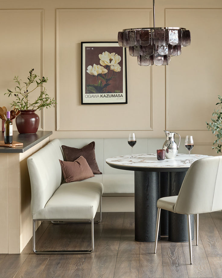 Light grey faux-leather left-hand corner bench with stainless steel frame, shown in modern dining setting.