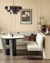 Light grey upholstered corner bench with black metal legs, right-hand orientation, shown in modern dining setting.