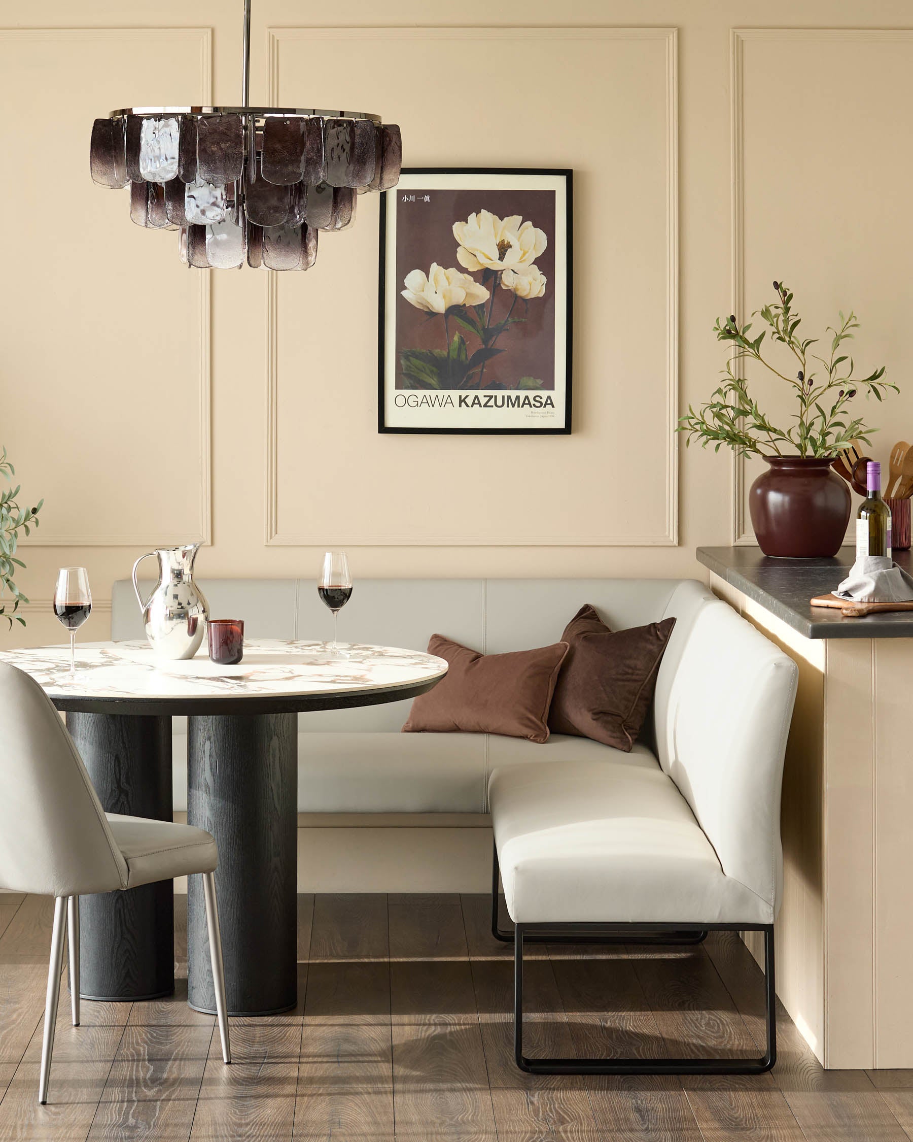 Light grey upholstered corner bench with black metal legs, right-hand orientation, shown in modern dining setting.