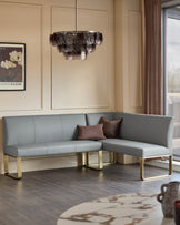 Loop 5-seater left-hand corner dining bench in mid-grey faux leather with brushed brass legs, styled in modern room.