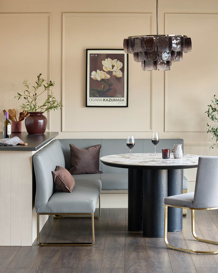 Loop 5-seater left-hand corner dining bench with brushed brass legs in mid-grey faux leather, styled in dining setting.