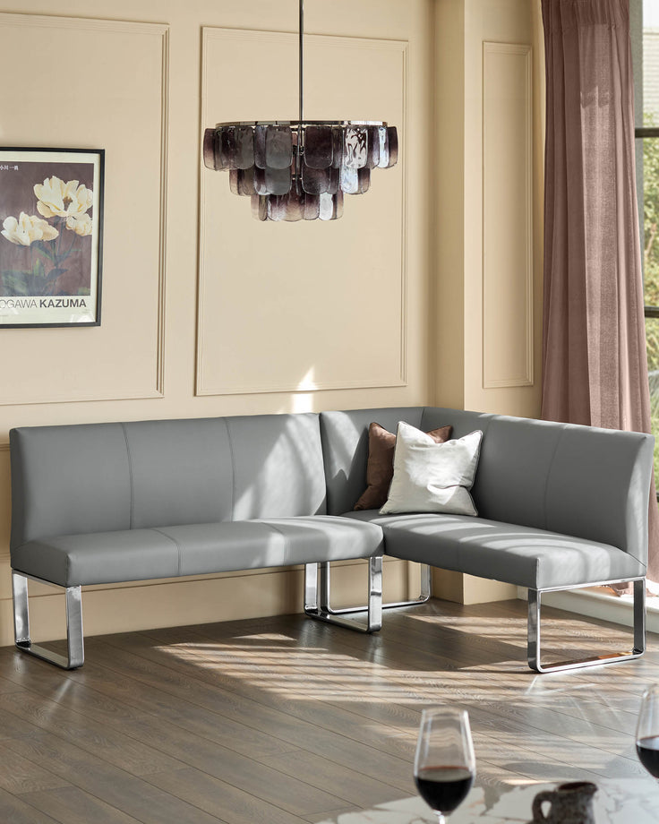 Loop 5-seater left-hand corner dining bench in mid-grey faux leather with chrome legs, shown in a modern room setting.