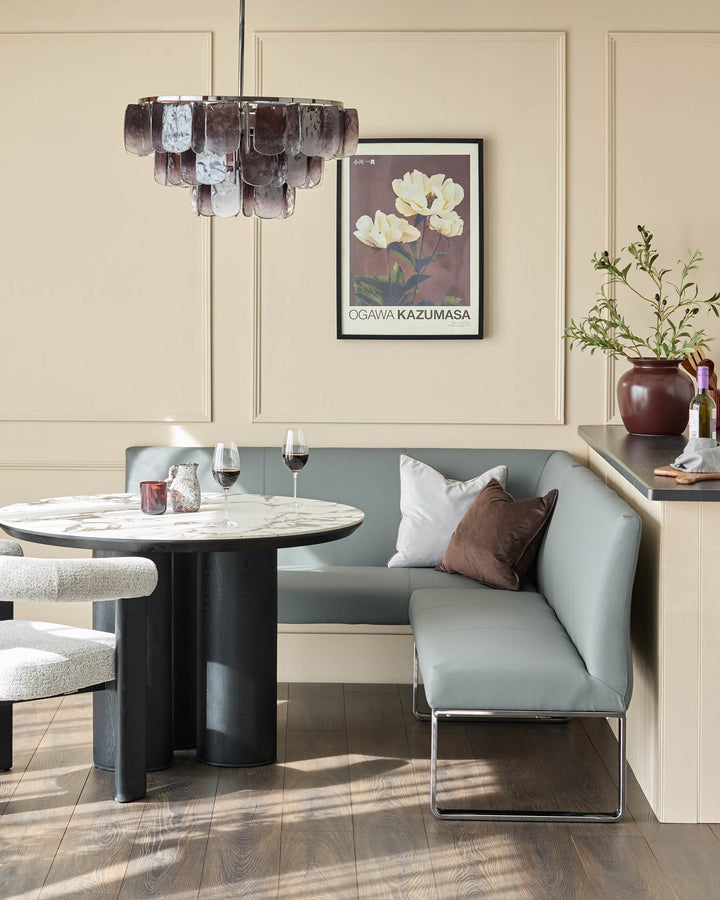 Loop 5-seater right-hand corner dining bench in mid-grey faux leather with chrome legs, styled in modern dining setting.