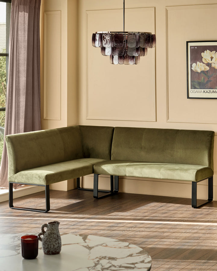 Loop 5-seater right-hand corner bench in olive green velvet with black metal legs, shown in a modern living room setting.