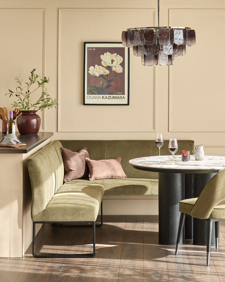 Loop 5-seater left-hand corner bench in olive green velvet with black metal legs, styled in a dining room setting.