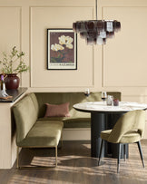 Smoked ombre glass chandelier with cylindrical shade in brown and white tones, suspended above a dining table.
