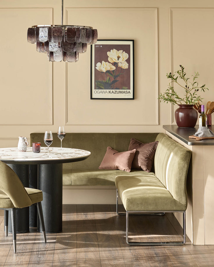 Loop 5-seater right-hand corner bench in olive green velvet with chrome legs, styled in dining setting.