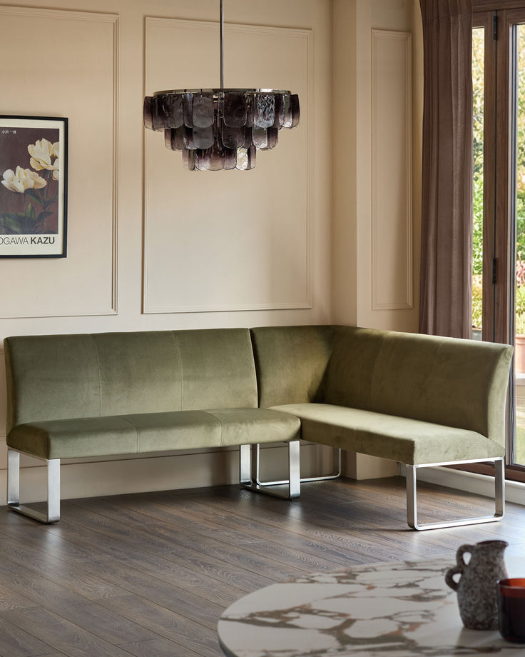 Loop 5-seater left-hand corner bench with stainless steel legs in olive green, shown in modern living room setting.