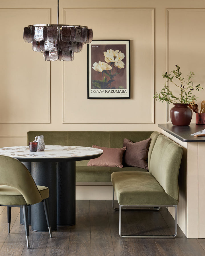 Loop 5-seater right-hand corner bench with stainless steel legs in olive green, styled in a modern dining space.
