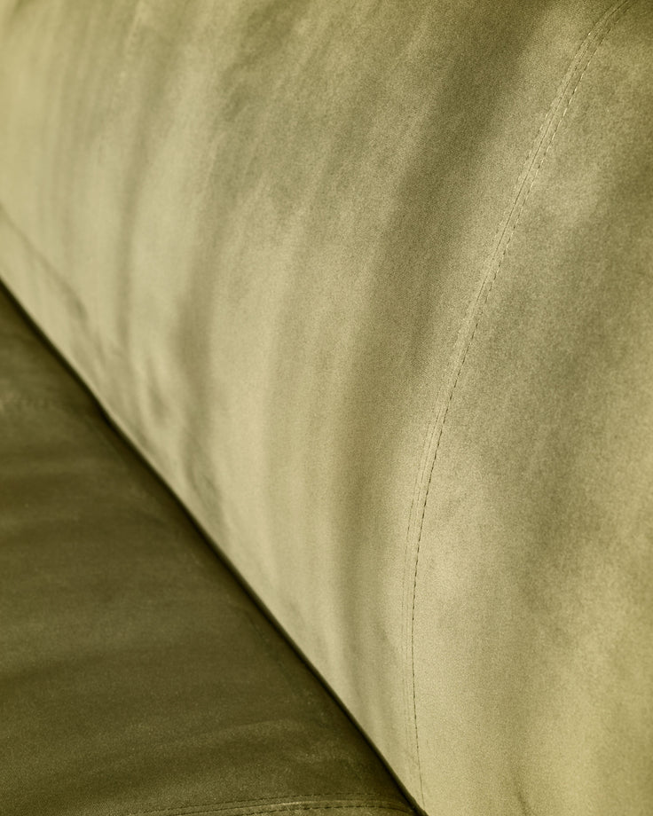Close-up of olive-green velvet upholstery on 3-seater bench, showing fabric texture and seam detail.