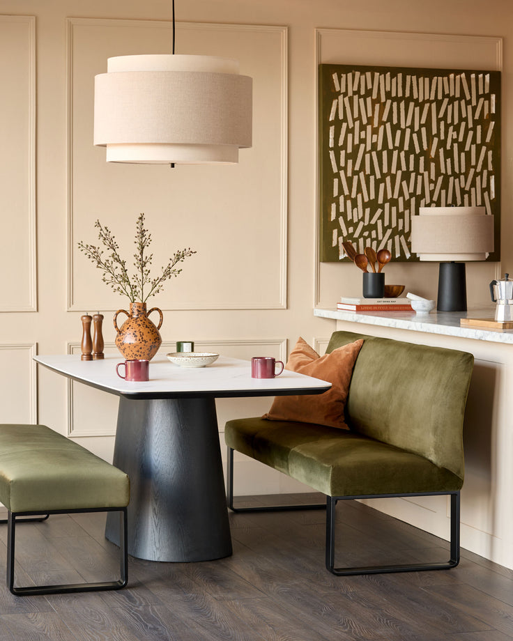 Loop 3-seater velvet bench with backrest in olive green with black metal frame, shown in modern interior setting.