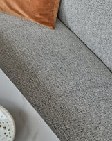 Grey fabric 3-seater bench with backrest, angled view showing textured upholstery and brown cushion detail.