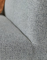 Close-up of grey fabric upholstery on Loop 3-seater bench, showing textured weave detail and backrest.