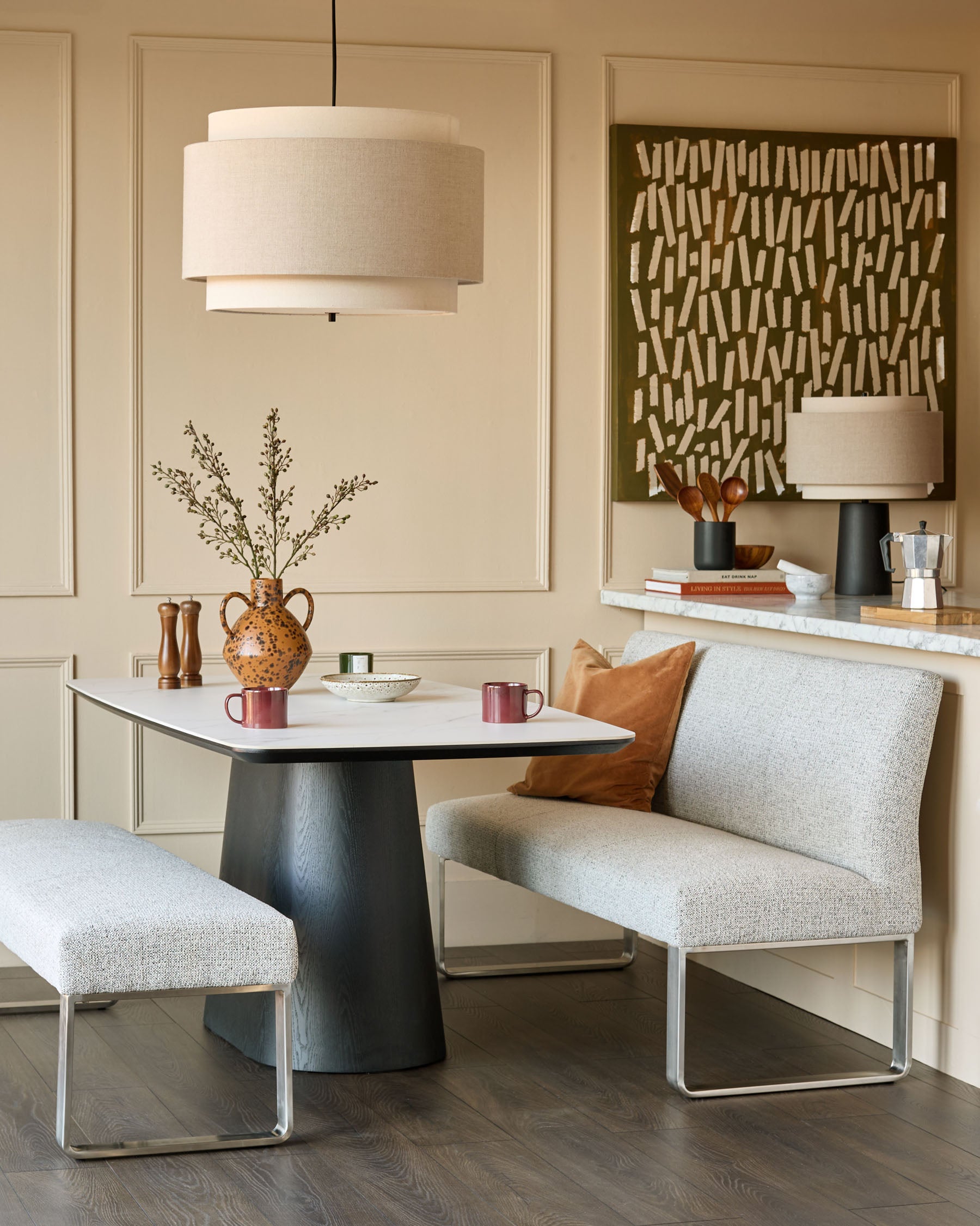 Loop 3-seater fabric bench with backrest in grey, stainless steel frame, shown in modern living room setting.