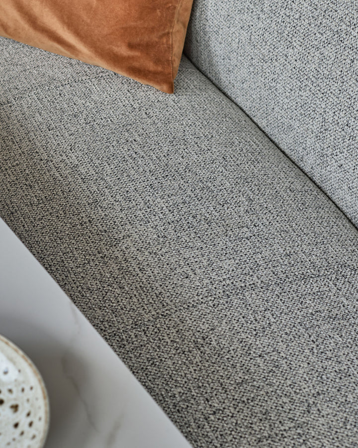 Grey fabric 3-seater bench with backrest and black metal frame, shown from above at an angle.