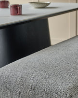 Grey fabric 3-seater bench without backrest, brushed brass frame, viewed from low angle showing textured upholstery.