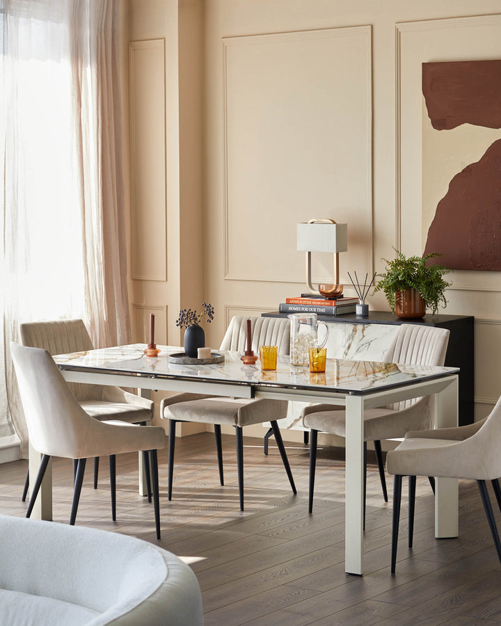 A modern dining set with a marble-effect table, upholstered chairs and a dark sideboard.