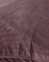 Luca cushion in mulberry, close-up detail showing soft velvet texture and fabric weave.