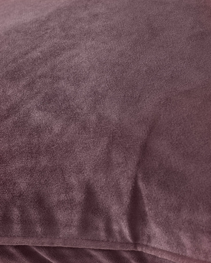 Luca cushion large in mulberry, showing close-up of soft velvet texture and fabric detail.