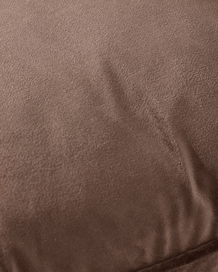 Luca Rectangle Cushion in chocolate brown, close-up showing soft textured fabric with subtle fold detail.