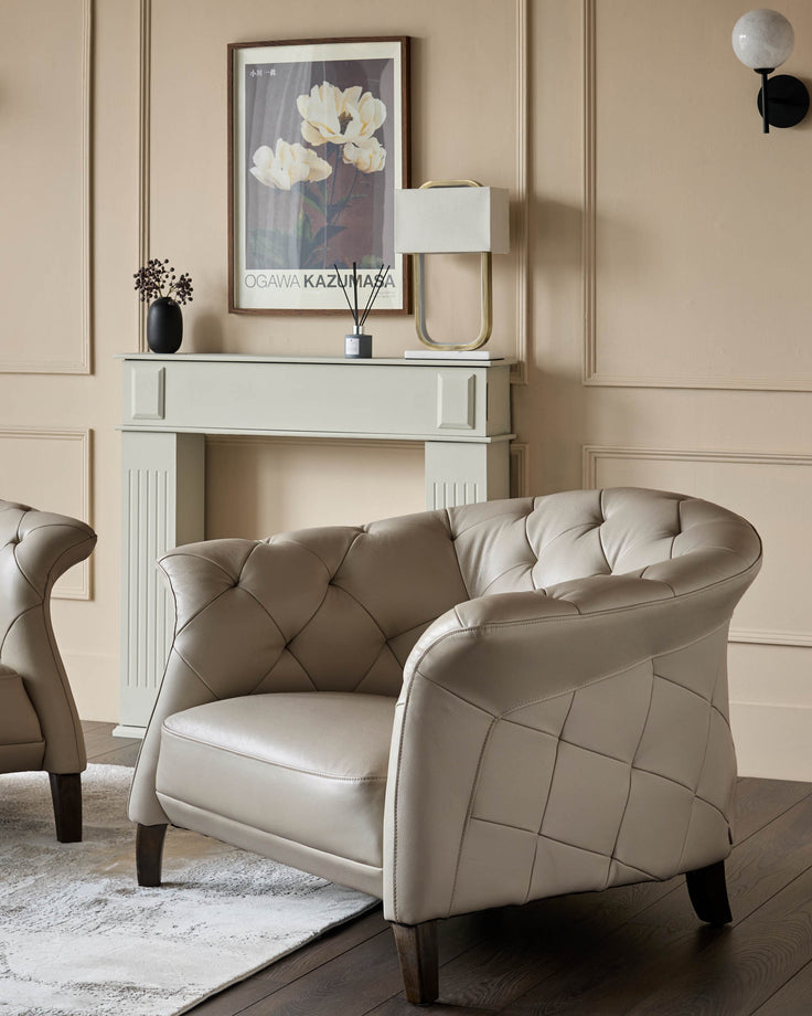 A luxurious cream leather armchair with buttoned detailing, set against a stylish backdrop.