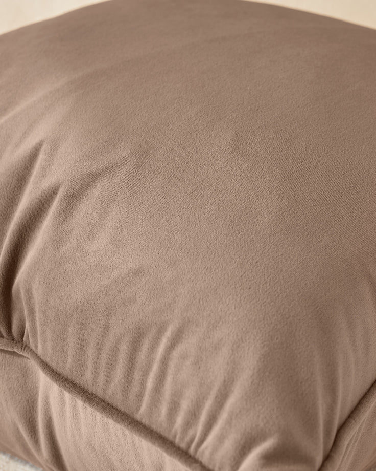 Luca rectangle cushion in mink, close-up showing soft fabric texture and gathered seam detail.
