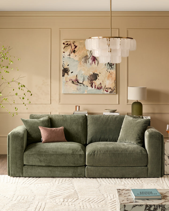 Lynetta 3-seater sofa in dark green weave fabric with cushions, displayed in a beige living room setting.