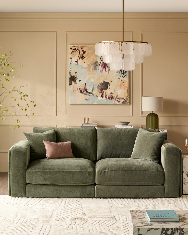 Lynetta 3-seater sofa in dark green weave fabric with cushions, displayed in a beige living room setting.