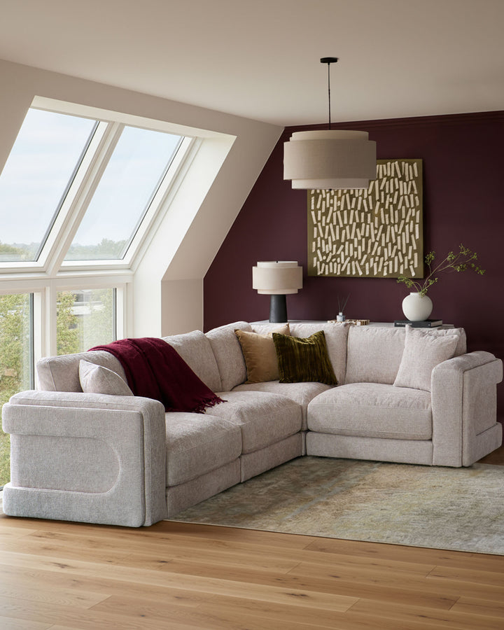 Lynetta small corner sofa in natural weave fabric, L-shaped configuration in a modern living room setting.