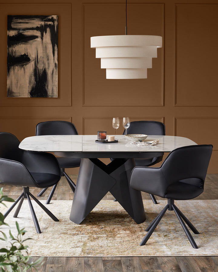A stylish dining set with a marble-topped table, black chairs, and a tiered light fitting above, set on a patterned rug.