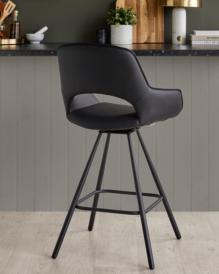 A black faux leather swivel bar stool with a metal frame and footrest against a neutral backdrop.