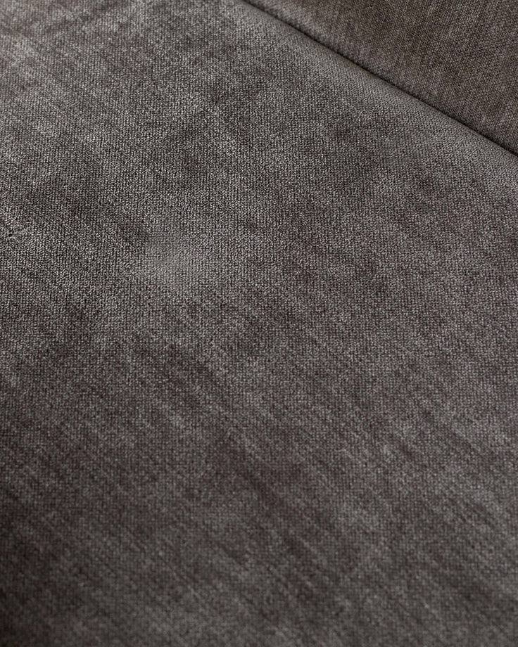 Close-up of textured brown fabric. Ideal for a modern sofa or chair upholstery, showcasing quality and style.