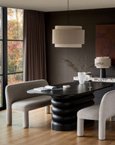 Mason 3-seater dining bench in light grey boucle, shown in modern dining setting with black table and matching chairs.